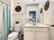 Bathroom with a single sink vanity, toilet and shower/tub combo at 4791 Terrasonesta Dr, Davenport, FL 33837