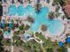 Large resort-style pool with multiple areas for swimming and relaxing at 4791 Terrasonesta Dr, Davenport, FL 33837