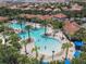 Large resort-style pool with multiple areas for swimming and relaxing at 4791 Terrasonesta Dr, Davenport, FL 33837