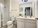 Bathroom with walk-in shower and accessible features at 4791 Terrasonesta Dr, Davenport, FL 33837