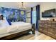 Main bedroom with Hogwarts mural, TV, and dresser at 4791 Terrasonesta Dr, Davenport, FL 33837