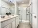 Double vanity bathroom with walk in shower at 4791 Terrasonesta Dr, Davenport, FL 33837