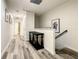 Upstairs hallway with wood-look floors at 4791 Terrasonesta Dr, Davenport, FL 33837