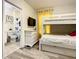 Bedroom with bunk beds, dresser, and en-suite bathroom at 4791 Terrasonesta Dr, Davenport, FL 33837