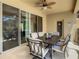 Enclosed patio with dining table and pool view at 4791 Terrasonesta Dr, Davenport, FL 33837