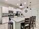 Modern kitchen with island, stainless steel appliances, and granite countertops at 4791 Terrasonesta Dr, Davenport, FL 33837