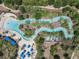 Lazy river water park with palm trees and lounge chairs at 4791 Terrasonesta Dr, Davenport, FL 33837
