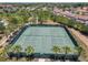 Two tennis courts with surrounding landscaping at 4791 Terrasonesta Dr, Davenport, FL 33837