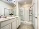Bathroom with double vanity, shower, and toilet at 4791 Terrasonesta Dr, Davenport, FL 33837