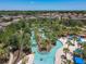 Lazy river water park with palm trees and lounge chairs at 4791 Terrasonesta Dr, Davenport, FL 33837