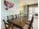 Spacious dining area with wood table and access to backyard at 4791 Terrasonesta Dr, Davenport, FL 33837