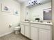 Clean bathroom with double vanity and a toilet at 4791 Terrasonesta Dr, Davenport, FL 33837