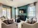 Living room with comfy sofas, a coffee table, and sliding doors leading to the patio at 4791 Terrasonesta Dr, Davenport, FL 33837