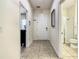 Bright entry hall with tile flooring, access to bathroom and other rooms at 4791 Terrasonesta Dr, Davenport, FL 33837