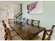 Dining room with wood table and chairs, view to backyard at 4791 Terrasonesta Dr, Davenport, FL 33837