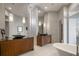 Luxurious bathroom with double vanities, soaking tub, and modern fixtures at 9721 Carillon Park Dr, Windermere, FL 34786