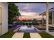 Luxury pool and spa with sunset views at 9721 Carillon Park Dr, Windermere, FL 34786