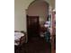 Hallway with wooden door and stacked items at 709 N Disston, Tavares, FL 32778