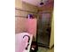 Bathroom with bathtub, shower, and pink tile at 709 N Disston, Tavares, FL 32778