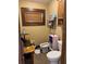 Small bathroom with toilet, sink, and bidet at 709 N Disston, Tavares, FL 32778