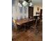 Dining area with clawfoot table and chandelier at 709 N Disston, Tavares, FL 32778