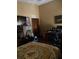 Bedroom with a double bed and a home office setup at 709 N Disston, Tavares, FL 32778
