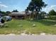 House with solar panels and a large yard at 709 N Disston, Tavares, FL 32778