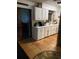 Kitchen with white cabinets and tile floor at 709 N Disston, Tavares, FL 32778