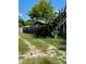 Backyard with a dirt path and tall cactus at 709 N Disston, Tavares, FL 32778