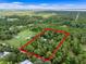 Aerial view of property showcasing expansive land and lush greenery at 1099 Bee Ln, Geneva, FL 32732