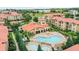 Aerial view of community pool and surrounding buildings at 901 Charo Pkwy # 732, Davenport, FL 33897