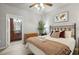 Main bedroom with a king-size bed and ensuite bathroom access at 901 Charo Pkwy # 732, Davenport, FL 33897