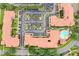 Aerial view of residential buildings, parking, and a pool at 901 Charo Pkwy # 732, Davenport, FL 33897