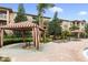 Relaxing pool area with striped cabanas and lounge chairs at 901 Charo Pkwy # 732, Davenport, FL 33897