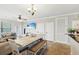 Bright dining area with a table and bench seating at 901 Charo Pkwy # 732, Davenport, FL 33897
