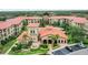 Aerial view of community with pool and clubhouse at 901 Charo Pkwy # 732, Davenport, FL 33897