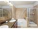 Bathroom boasts a large soaking tub, double sinks, and a walk-in shower at 901 Charo Pkwy # 732, Davenport, FL 33897