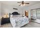 Bright Primary bedroom with king-size bed and access to bathroom at 901 Charo Pkwy # 732, Davenport, FL 33897