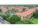 Condo community featuring multiple buildings and ample parking at 901 Charo Pkwy # 732, Davenport, FL 33897