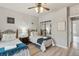 Twin bedroom with two beds, ceiling fan, and mirrored closet doors at 901 Charo Pkwy # 732, Davenport, FL 33897