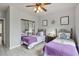 Charming bedroom with twin beds, nightstands, and mirrored closet doors at 901 Charo Pkwy # 732, Davenport, FL 33897