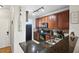 Modern kitchen with dark wood cabinets and granite counters at 901 Charo Pkwy # 732, Davenport, FL 33897