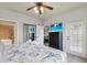 Primary bedroom with king bed, dresser, and balcony access at 901 Charo Pkwy # 732, Davenport, FL 33897