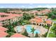 Aerial view of the community, showcasing pools and buildings at 901 Charo Pkwy # 732, Davenport, FL 33897