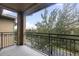 Spacious balcony overlooking a tree and neighborhood at 901 Charo Pkwy # 732, Davenport, FL 33897