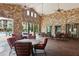Stone patio with comfortable seating areas and pool views at 901 Charo Pkwy # 732, Davenport, FL 33897