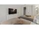 Bedroom with twin beds, dresser, TV, and closet at 6165 Carrier Dr # 1206, Orlando, FL 32819
