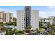 High rise building exterior with pool and surrounding landscape at 6165 Carrier Dr # 1206, Orlando, FL 32819