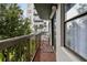Private balcony with seating and partial view of building at 6165 Carrier Dr # 1206, Orlando, FL 32819