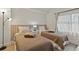 Two twin beds, nightstands, and ample natural light at 6165 Carrier Dr # 1206, Orlando, FL 32819